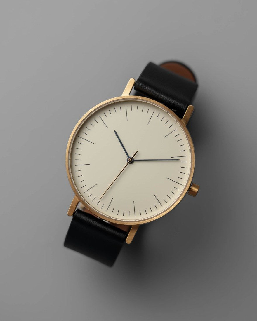 B001 gold case, black leather strap, top view
