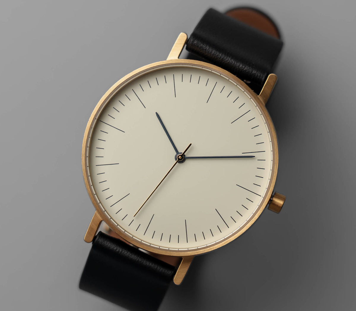 B001 gold case, off-white dial, black leather strap