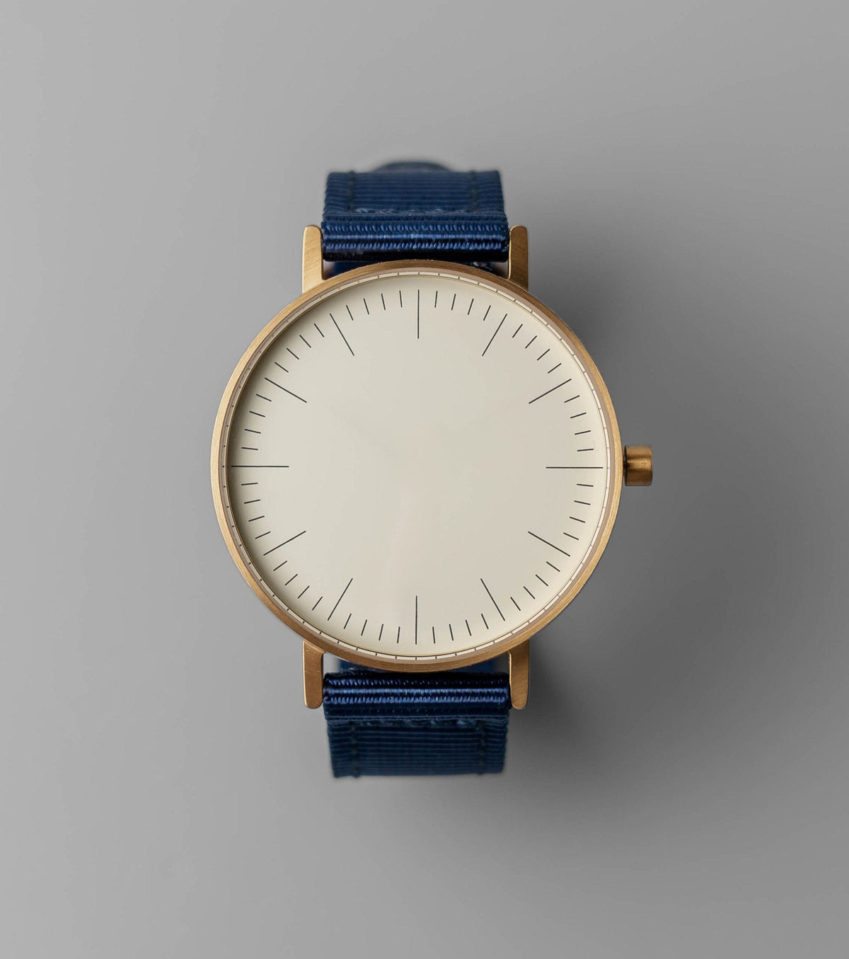 B001 watch, gold case, off white dial, navy nylon strap